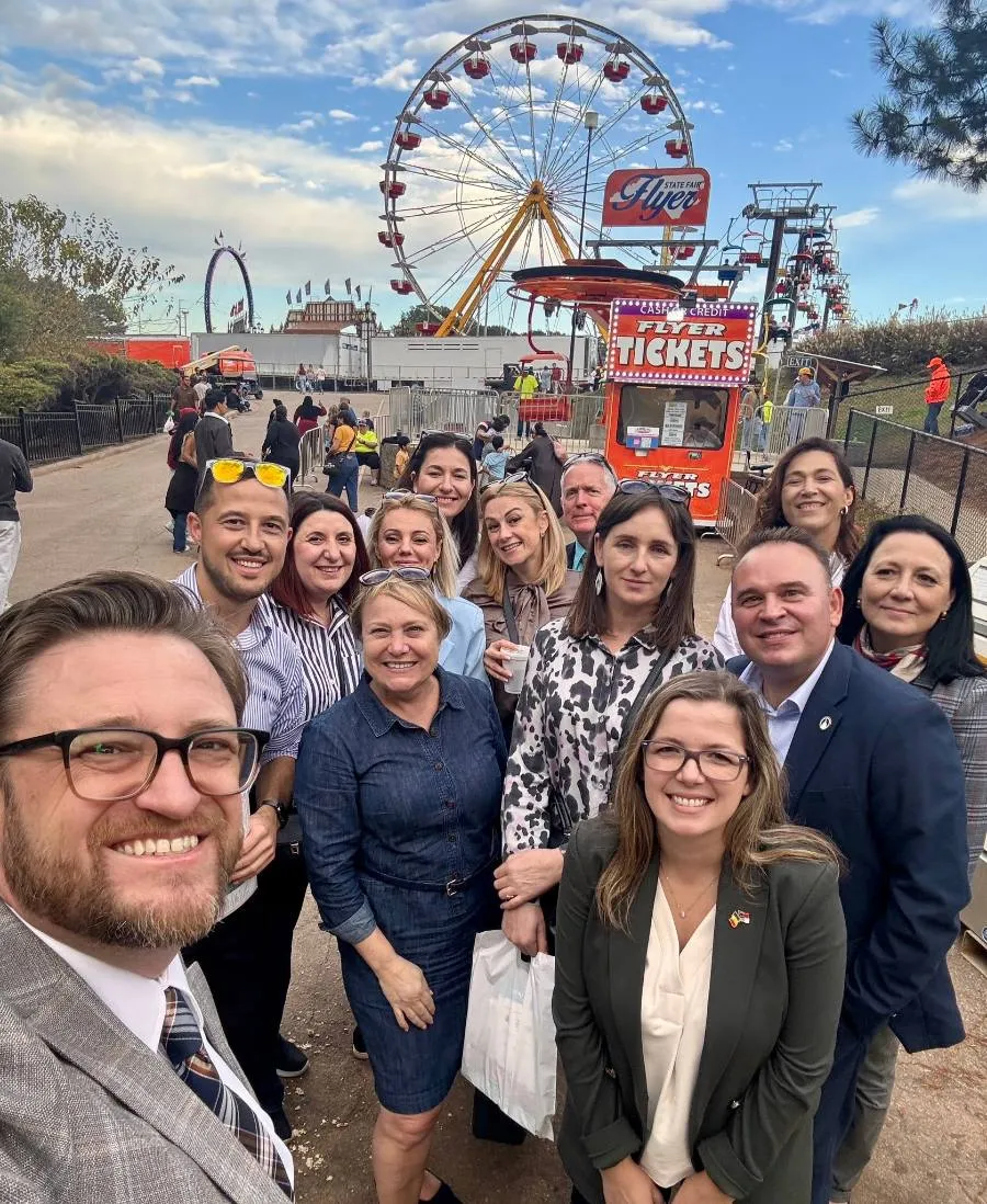 October 2025 delegates and Rotarians taking a selfie at the North Carolina State Fair